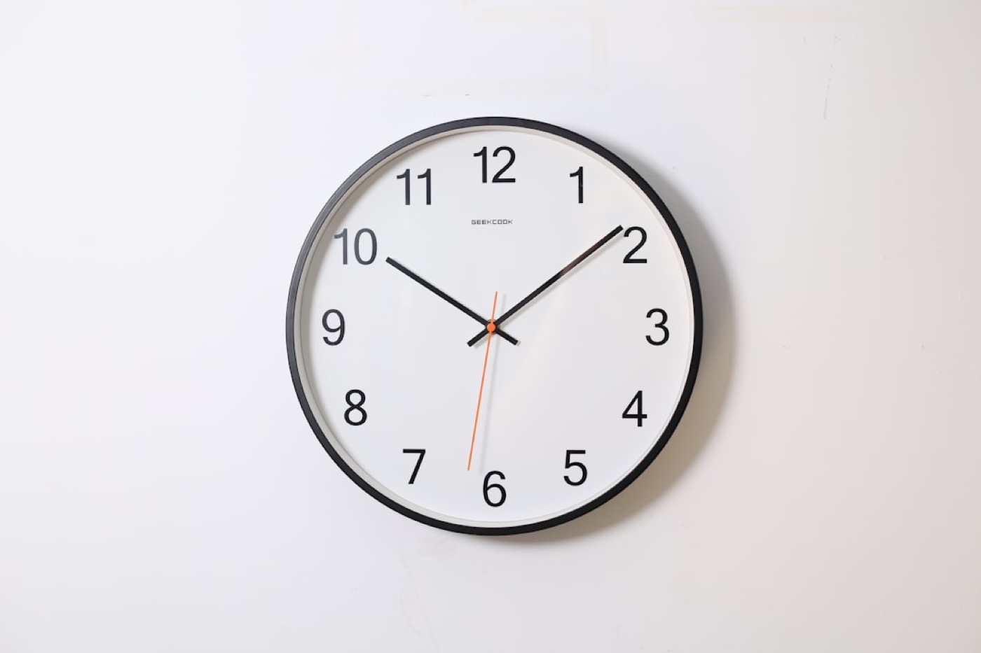 A clock on a trading floor wall conveying time pressure