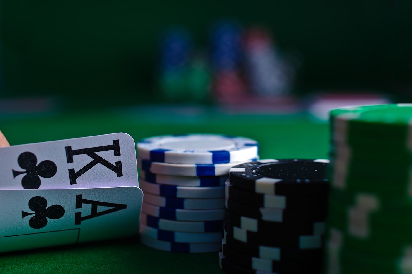 Poker chips and cards on a table, representing probabilistic decision-making under variance